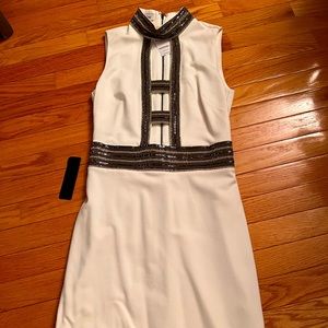 Bebe, Size 4, white, never worn new with tags.